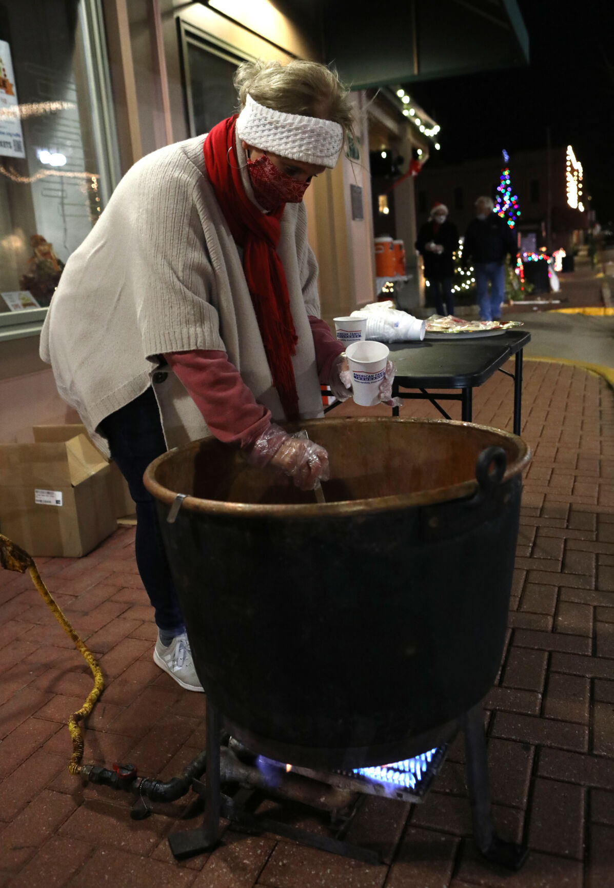Karen Timpe serves hot cider